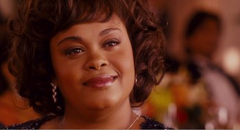 Movie still from “Why Did I Get Married?” (2007), directed by Tyler Perry – A person with curly brown hair; Close Up shot, Over the shoulder angle