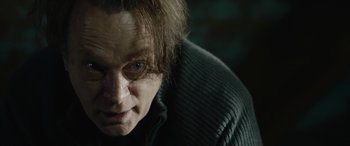 Movie still from “Wildling” (2018), directed by Fritz Böhm – A person wearing a sweater; Close Up shot, Over the shoulder angle