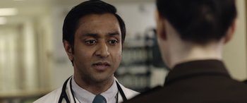 Movie still from “Wildling” (2018), directed by Fritz Böhm – A man wearing a white shirt and a blue tie talking to another man wearing a white shirt and a blue tie; Close Up shot, Over the shoulder angle