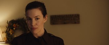 Movie still from “Wildling” (2018), directed by Fritz Böhm – A person wearing a black shirt; Close Up shot, Over the shoulder angle