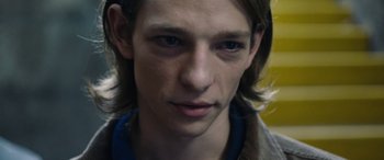 Movie still from “Wildling” (2018), directed by Fritz Böhm – A person with long hair; Close Up shot, Over the shoulder angle