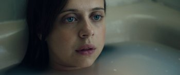 Movie still from “Wildling” (2018), directed by Fritz Böhm – A person with blue eyes; Close Up shot, Overhead angle