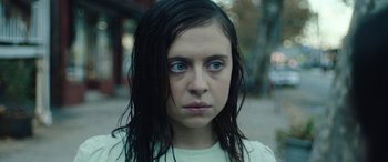 Movie still from “Wildling” (2018), directed by Fritz Böhm – A young woman with blue eyes stares into the camera; Close Up shot, Low angle