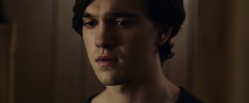 Movie still from “Wildling” (2018), directed by Fritz Böhm – A person with long hair; Close Up shot, Over the shoulder angle