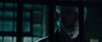 Movie still from “Wildling” (2018), directed by Fritz Böhm – A person wearing a hat; Close Up shot, Over the shoulder angle