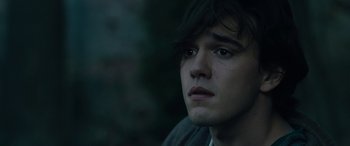 Movie still from “Wildling” (2018), directed by Fritz Böhm – A person looking at the camera; Close Up shot, Over the shoulder angle