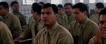 Movie still from “Windtalkers” (2002), directed by John Woo – A group of men standing next to each other in a room; Close Up shot, Over the shoulder angle