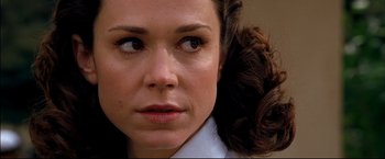 Movie still from “Windtalkers” (2002), directed by John Woo – A woman's face with brown hair; Close Up shot, Over the shoulder angle