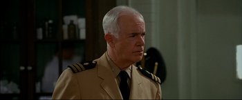 Movie still from “Windtalkers” (2002), directed by John Woo – An older man in a military uniform looking to his left; Close Up shot, Over the shoulder angle