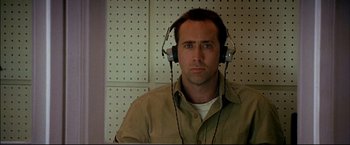 Movie still from “Windtalkers” (2002), directed by John Woo – A man wearing headphones and a brown shirt; Close Up shot, Low angle