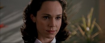 Movie still from “Windtalkers” (2002), directed by John Woo – A person wearing a suit and tie; Close Up shot, Over the shoulder angle