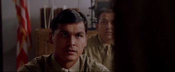 Movie still from “Windtalkers” (2002), directed by John Woo – A man in a military uniform looking into a mirror; Close Up shot, Over the shoulder angle
