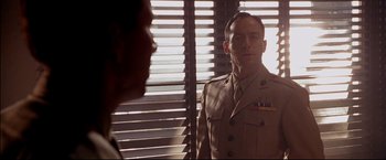 Movie still from “Windtalkers” (2002), directed by John Woo – A man in a military uniform looking into a mirror; Close Up shot, Over the shoulder angle