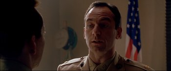 Movie still from “Windtalkers” (2002), directed by John Woo – A person wearing a uniform; Close Up shot, Low angle