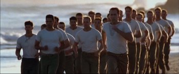 Movie still from “Windtalkers” (2002), directed by John Woo – A large group of men in white shirts and brown pants; Medium shot, High angle