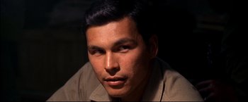 Movie still from “Windtalkers” (2002), directed by John Woo – A person wearing a brown shirt; Close Up shot, High angle