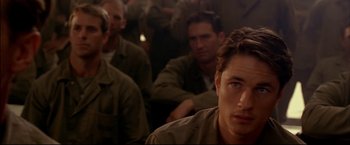 Movie still from “Windtalkers” (2002), directed by John Woo – A group of men sitting next to each other in a room; Close Up shot, Over the shoulder angle