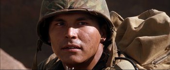 Movie still from “Windtalkers” (2002), directed by John Woo – A person wearing a helmet; Close Up shot, Low angle