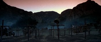 Movie still from “Windtalkers” (2002), directed by John Woo – A group of people standing in the grass; Extreme Wide shot, Low angle