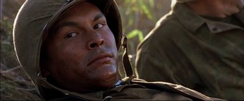 Movie still from “Windtalkers” (2002), directed by John Woo – A person wearing a hat; Close Up shot, Low angle