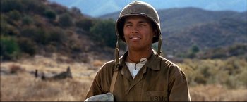 Movie still from “Windtalkers” (2002), directed by John Woo – A man wearing a military uniform and a helmet; Close Up shot, Low angle