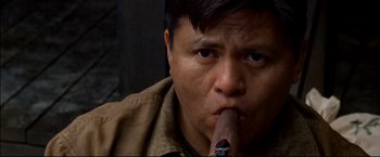 Movie still from “Windtalkers” (2002), directed by John Woo – A person with a cigar in his mouth; Close Up shot, Low angle