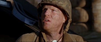 Movie still from “Windtalkers” (2002), directed by John Woo – A person wearing a hat; Close Up shot, Low angle