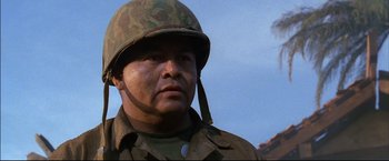 Movie still from “Windtalkers” (2002), directed by John Woo – A man in a military uniform wearing a helmet; Close Up shot, Low angle