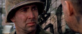 Movie still from “Windtalkers” (2002), directed by John Woo – A person wearing a hat; Close Up shot, Over the shoulder angle