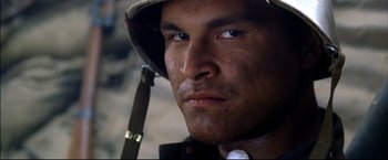 Movie still from “Windtalkers” (2002), directed by John Woo – A person wearing a hat; Close Up shot, Low angle