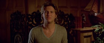 Movie still from “Winter Kills” (1979), directed by William Richert – A person with long hair; Close Up shot, Low angle