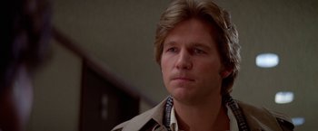 Movie still from “Winter Kills” (1979), directed by William Richert – A person wearing a jacket; Close Up shot, Low angle