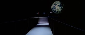 Movie still from “Winter Kills” (1979), directed by William Richert – A staircase leading to the top of a building; Extreme Wide shot, High angle