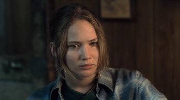 Movie still from “Winter's Bone” (2010), directed by Debra Granik – A woman with a plaid shirt is looking at the camera; Close Up shot, High angle
