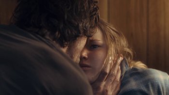 Movie still from “Winter's Bone” (2010), directed by Debra Granik – A man and a woman embracing each other in front of a mirror; Extreme Close Up shot, Over the shoulder angle