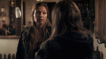 Movie still from “Winter's Bone” (2010), directed by Debra Granik – A woman looking at herself in the mirror; Medium shot, Over the shoulder angle