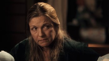 Movie still from “Winter's Bone” (2010), directed by Debra Granik – A person with long brown hair; Close Up shot, Over the shoulder angle