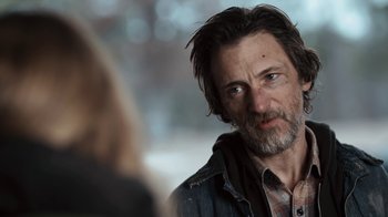 Movie still from “Winter's Bone” (2010), directed by Debra Granik – A person with a beard; Close Up shot, Over the shoulder angle