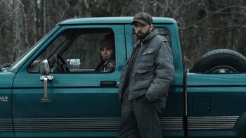 Movie still from “Winter's Bone” (2010), directed by Debra Granik – A man and a woman in a truck; Medium shot, Low angle