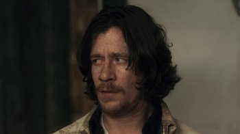 Movie still from “Winter's Bone” (2010), directed by Debra Granik – A person with long black hair; Close Up shot, Over the shoulder angle