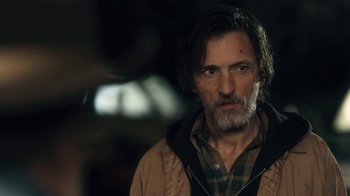 Movie still from “Winter's Bone” (2010), directed by Debra Granik – A person with a beard; Close Up shot, Over the shoulder angle