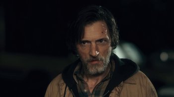 Movie still from “Winter's Bone” (2010), directed by Debra Granik – A person with a beard; Close Up shot, Low angle