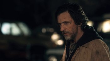 Movie still from “Winter's Bone” (2010), directed by Debra Granik – A person wearing a jacket; Close Up shot, Over the shoulder angle