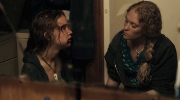 Movie still from “Winter's Bone” (2010), directed by Debra Granik – Two women looking at each other in a mirror; Close Up shot, Over the shoulder angle