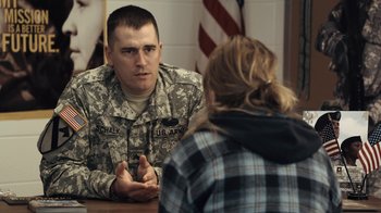 Movie still from “Winter's Bone” (2010), directed by Debra Granik – A man in a military uniform talking to a woman; Medium shot, Over the shoulder angle