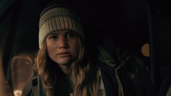 Movie still from “Winter's Bone” (2010), directed by Debra Granik – A woman with a hat on looking into the distance; Close Up shot, Over the shoulder angle