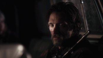 Movie still from “Winter's Bone” (2010), directed by Debra Granik – A person with a beard; Close Up shot, Over the shoulder angle