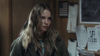 Movie still from “Winter's Bone” (2010), directed by Debra Granik – A young woman with long hair is looking at the camera; Close Up shot, Over the shoulder angle