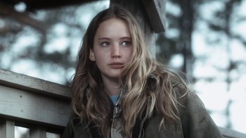 Movie still from “Winter's Bone” (2010), directed by Debra Granik – A woman with long blonde hair wearing a green jacket; Close Up shot, Low angle