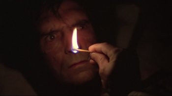 Movie still from “Wise Blood” (1979), directed by John Huston – A man lighting a match in the dark; Close Up shot, Low angle